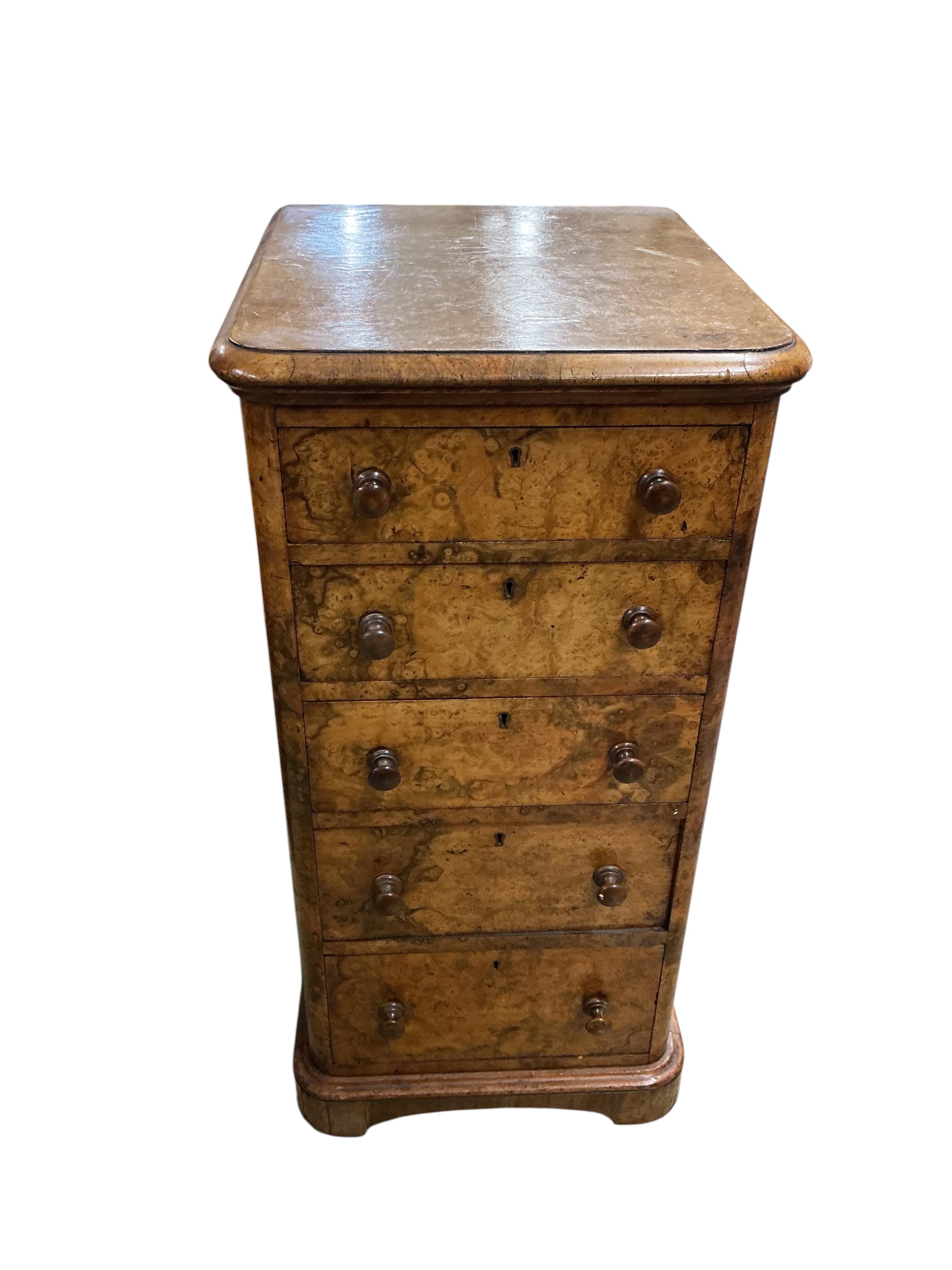 A pair of Victorian figured walnut five drawer bedside chests, adapted from a dressing table, width 43cm, depth 47cm, height 86cm